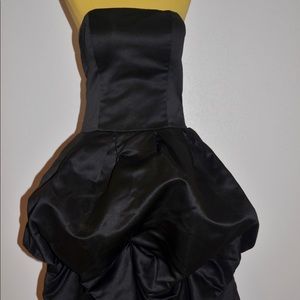 Black short puff style dress.