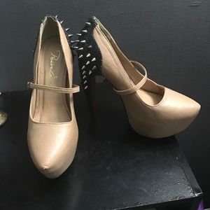 Tan and black spike heel