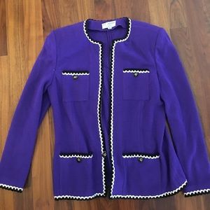 Purple zip up jacket.