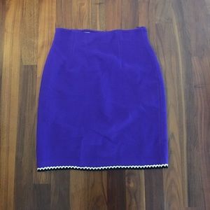 Purple skirt with black and white trim