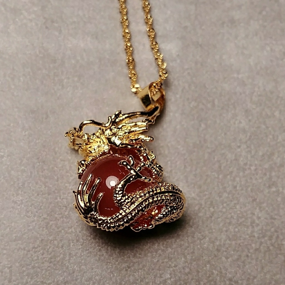 Gold Dragon necklace holding a rare red jade NWOT