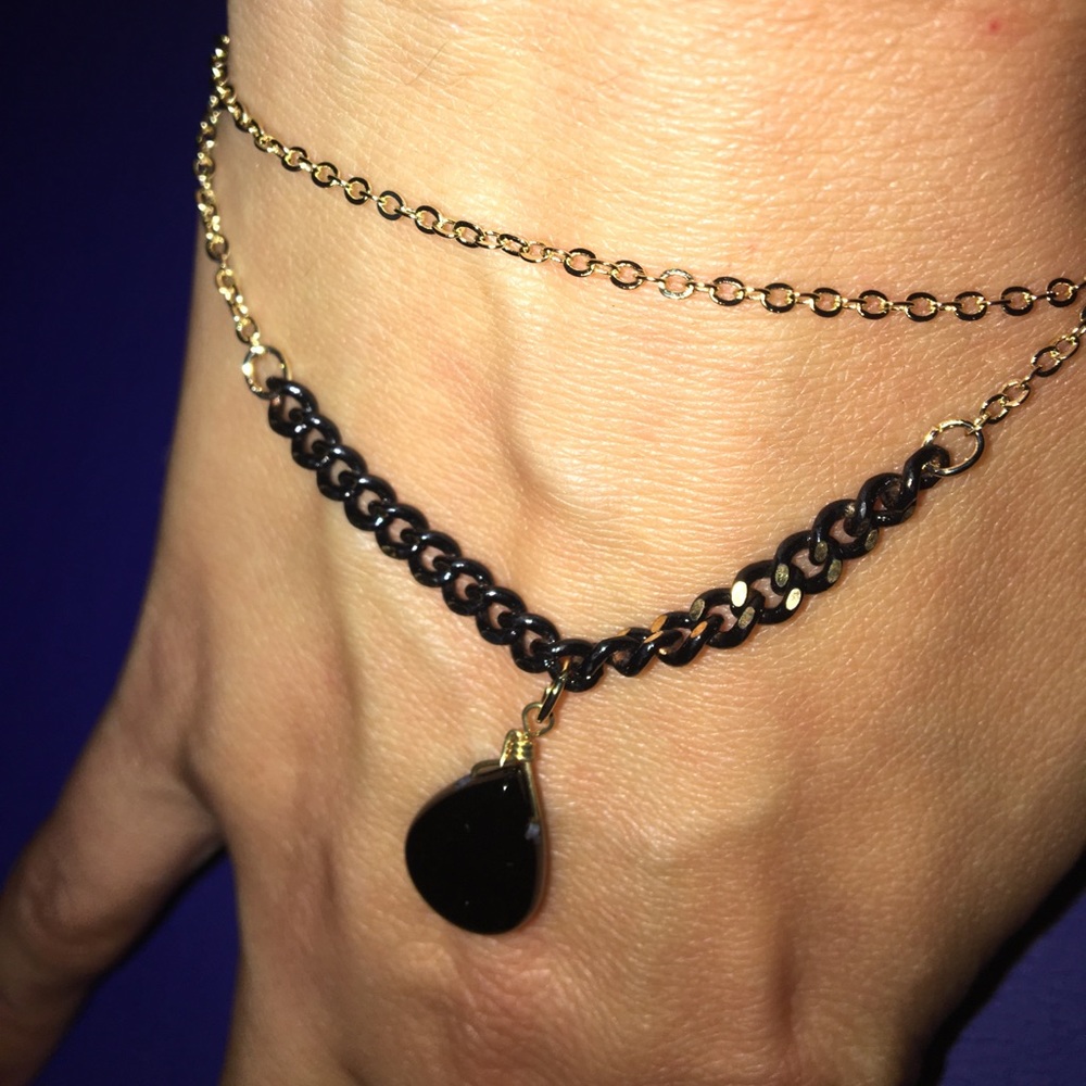 Gold double chain bracelet with black crystal