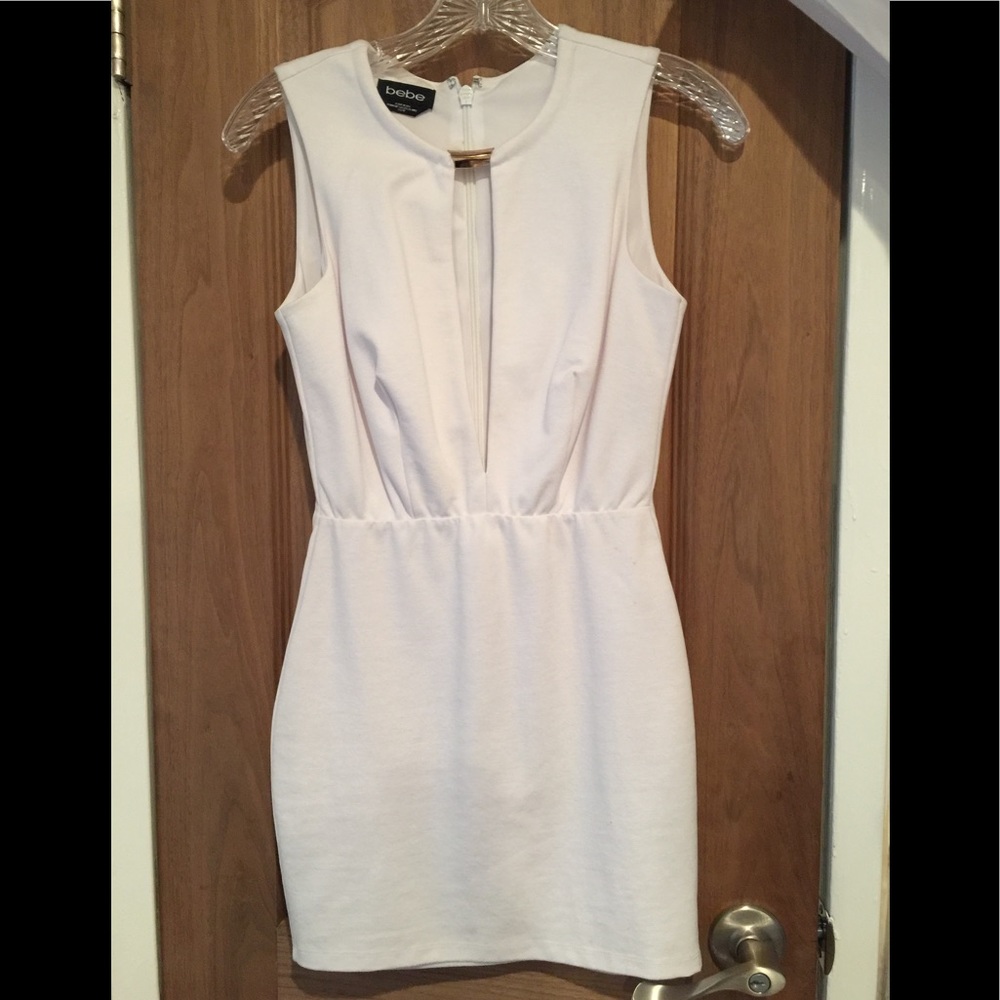 White Bebe mini dress with cut out and gold accent