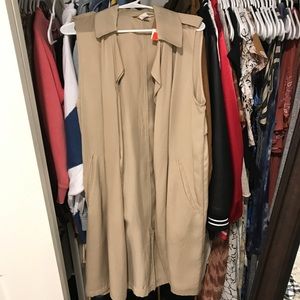 Never before worn, long trench style vest
