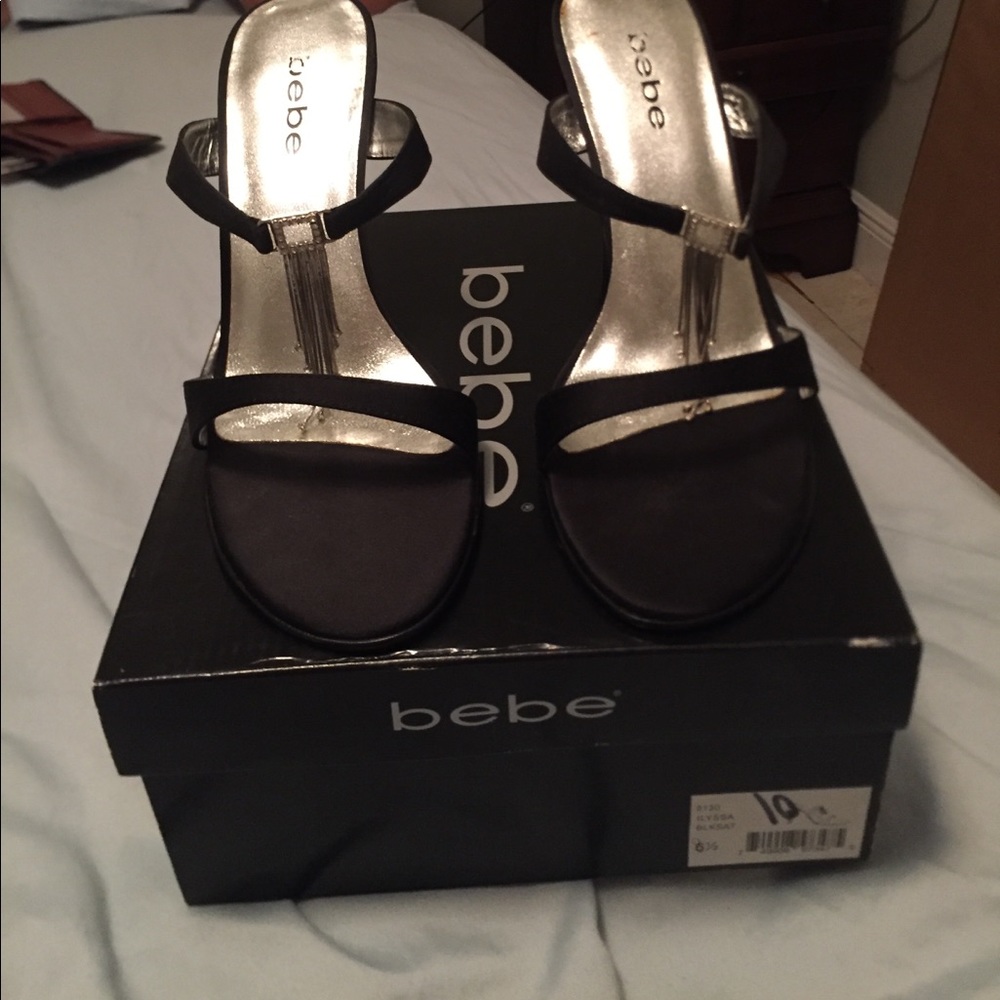 BEBE never worn black strappy heals.