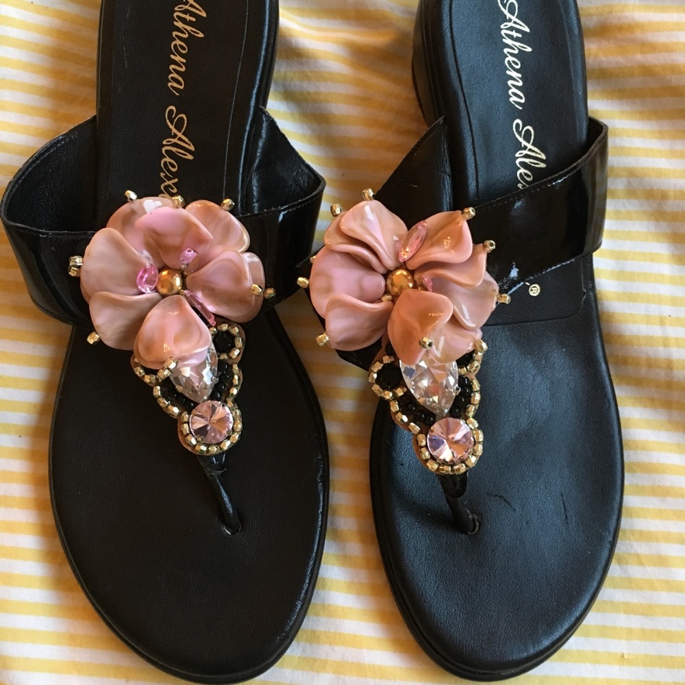 Super cute black wedge sandals with flower accent