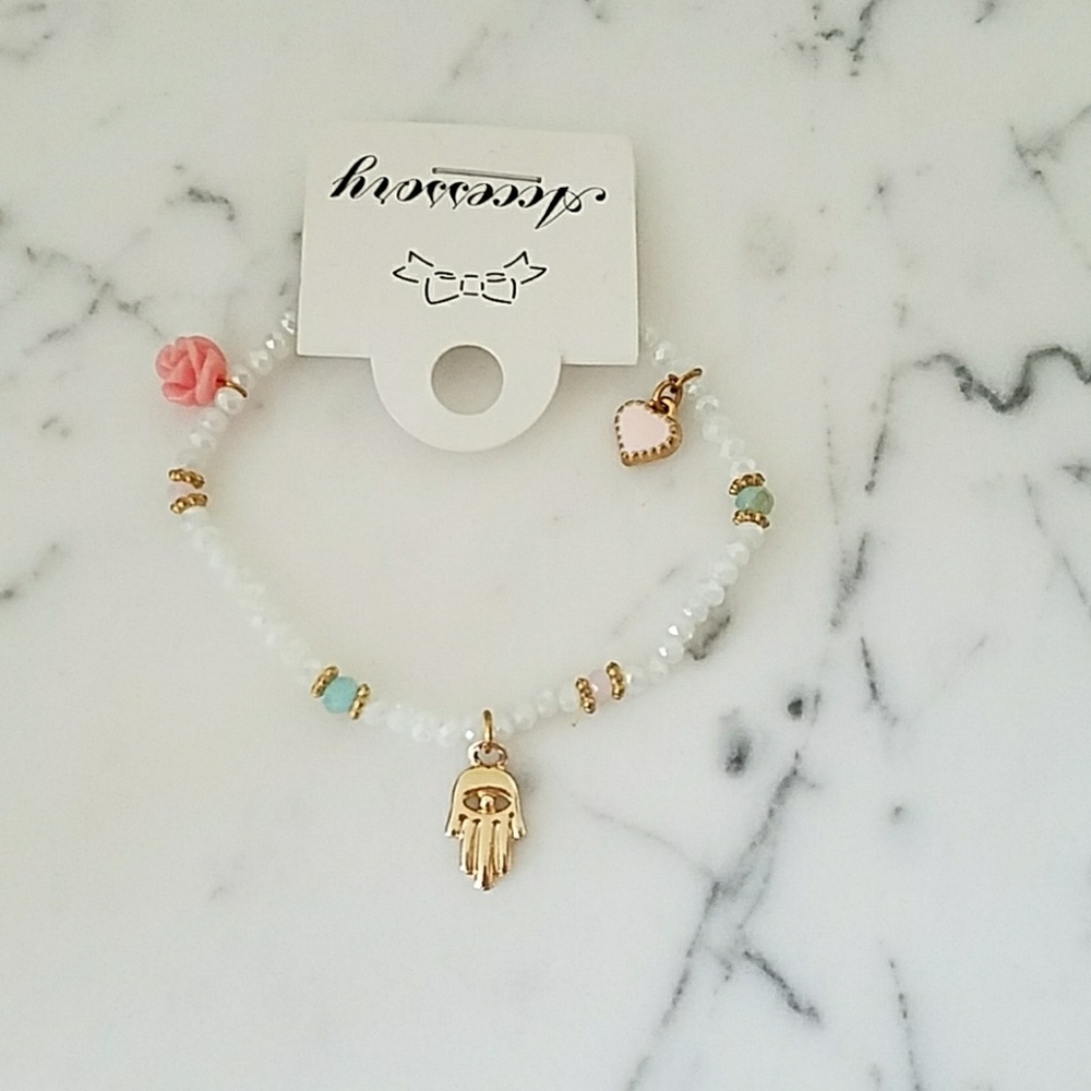 Protecting hand beads and charms bracelet