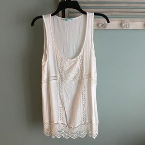 Sleeveless lace top.