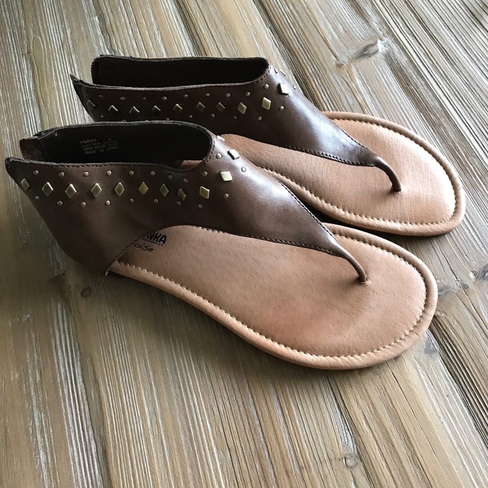 Brown leather sandals. Antique bronze studs.