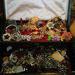 A box of antique costume jewelry