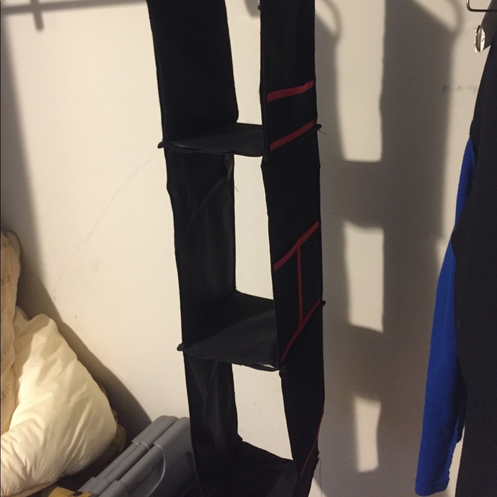 Black and Red three shelf organizer with pockets