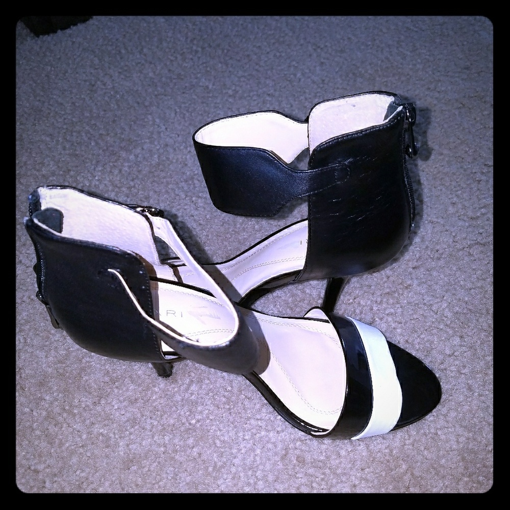 Tahari heels . Worn once for an all black party.
