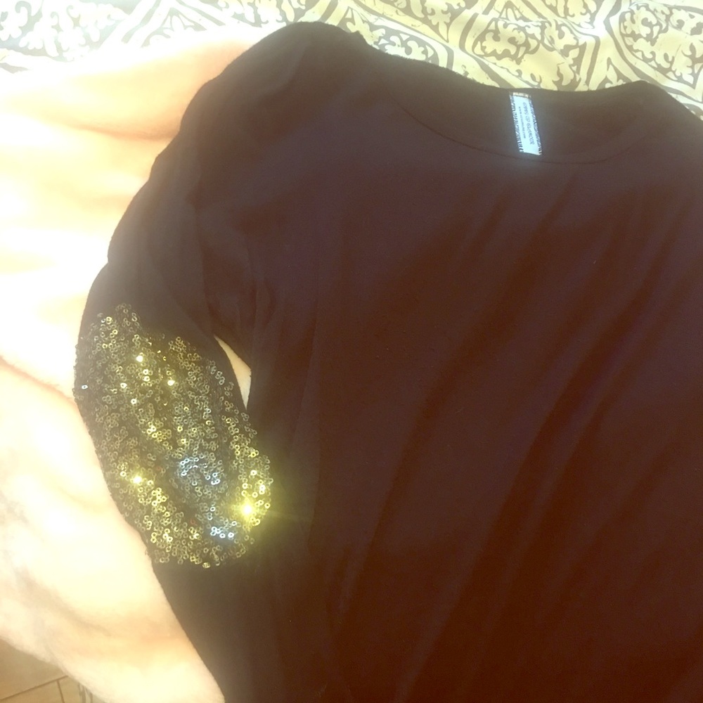Black top with gold sequin elbow patches