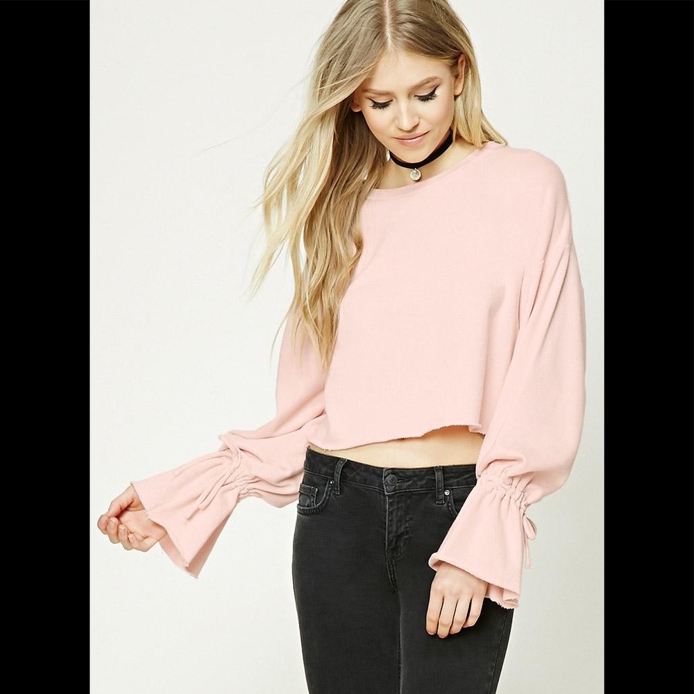 Bell sleeve pink raw cut cropped sweatshirt