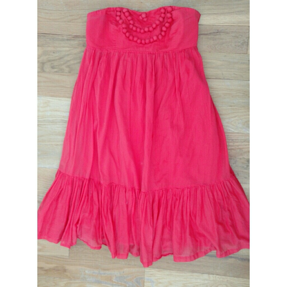 Coral dress with pom pom details