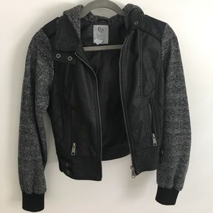 Faux leather jacket with knit sleeves and hood