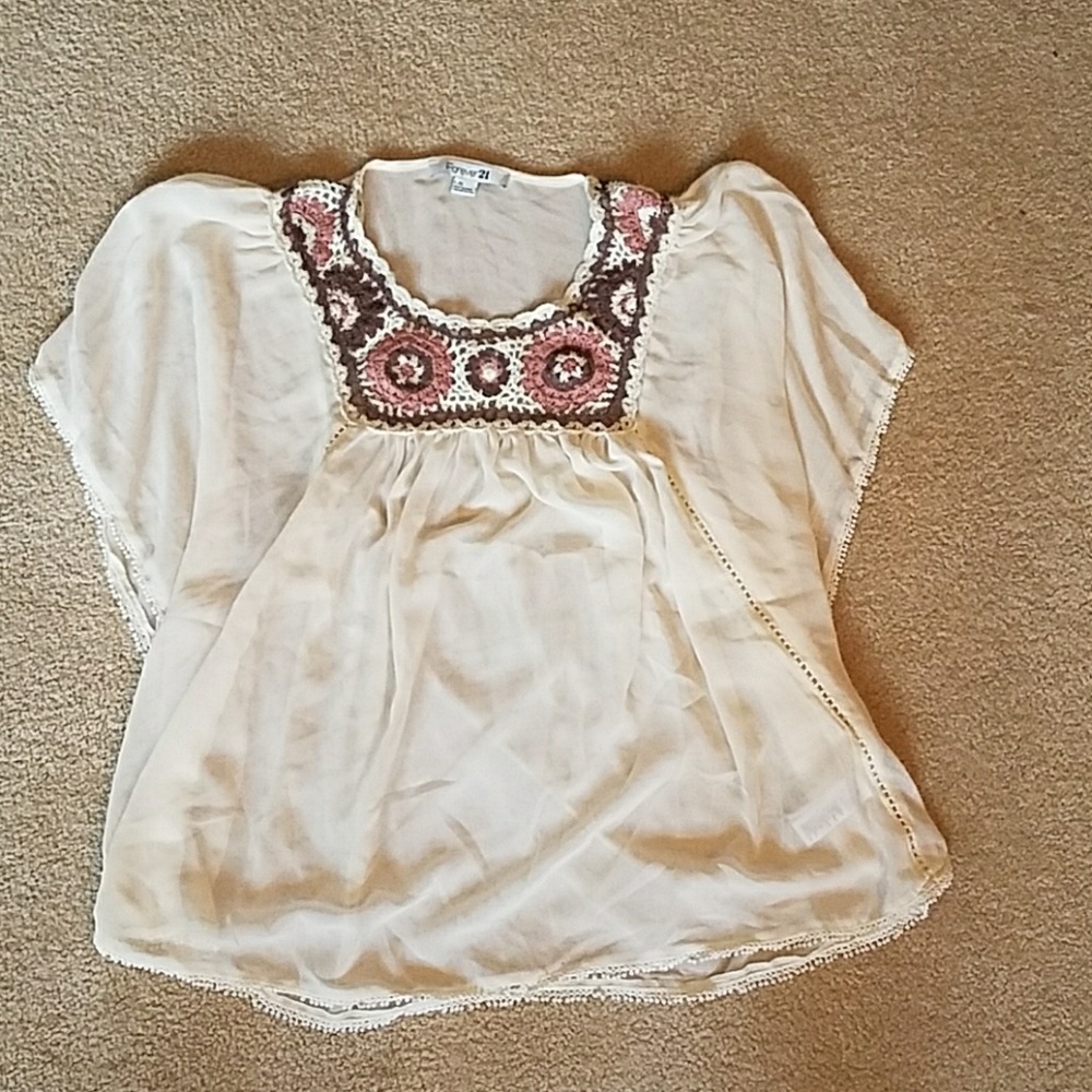 Pretty sheer top with knit flowers at the top
