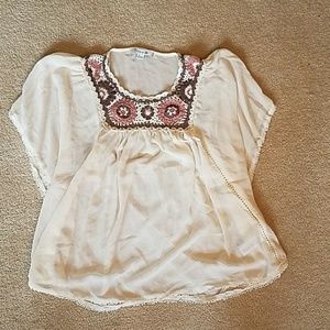 Pretty sheer top with knit flowers at the top