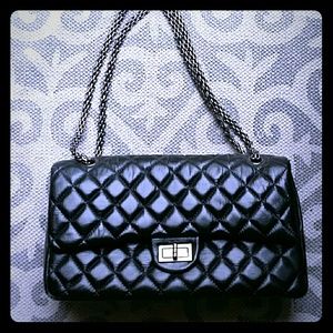 Leather quilted double flap handbag