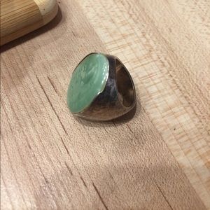 Silver ring with green stone.