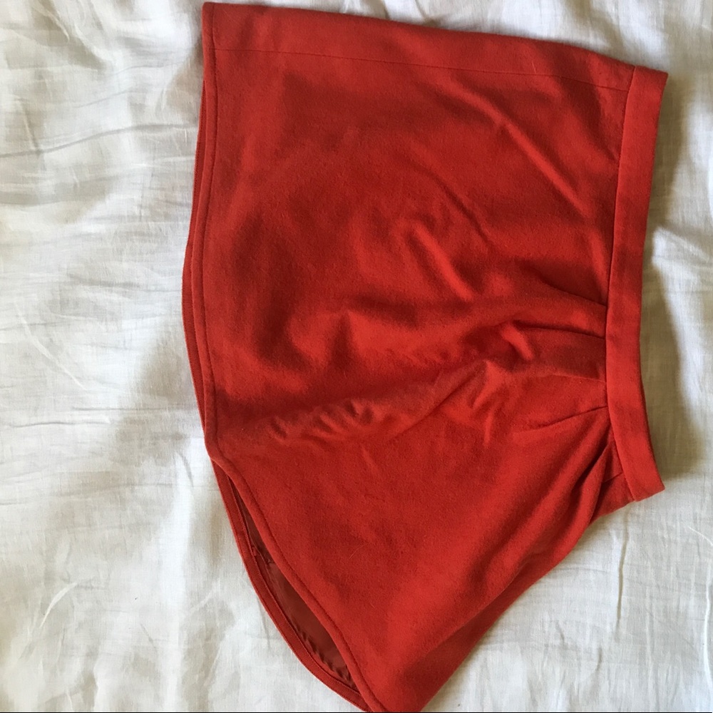 Burnt orange mini with side pleat
