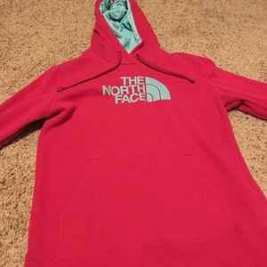 Pink & teal North Face hoodie.