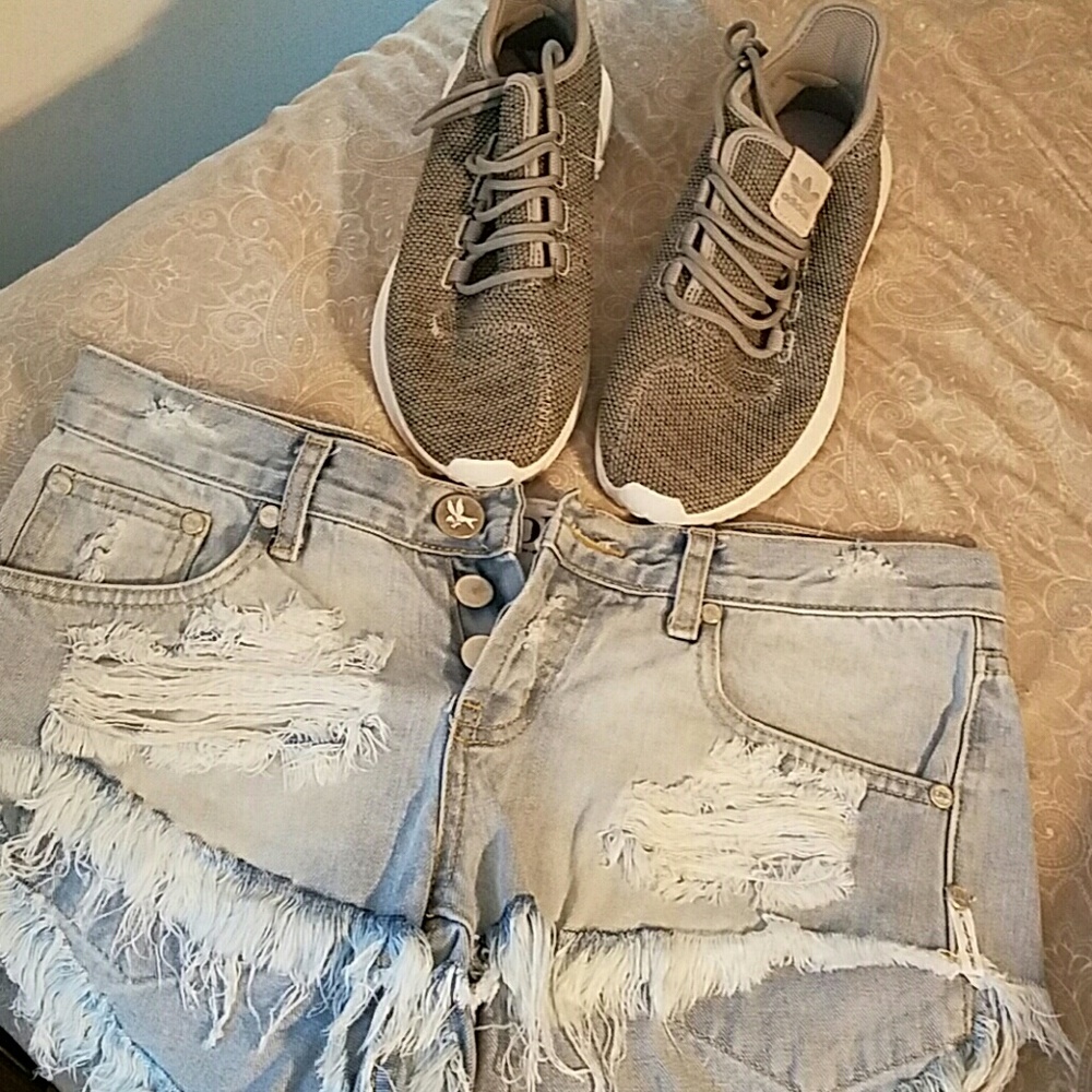 Pair of Adidas shoes and American  Eagle  shorts