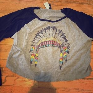 Long sleeve crop top, head dress in center.