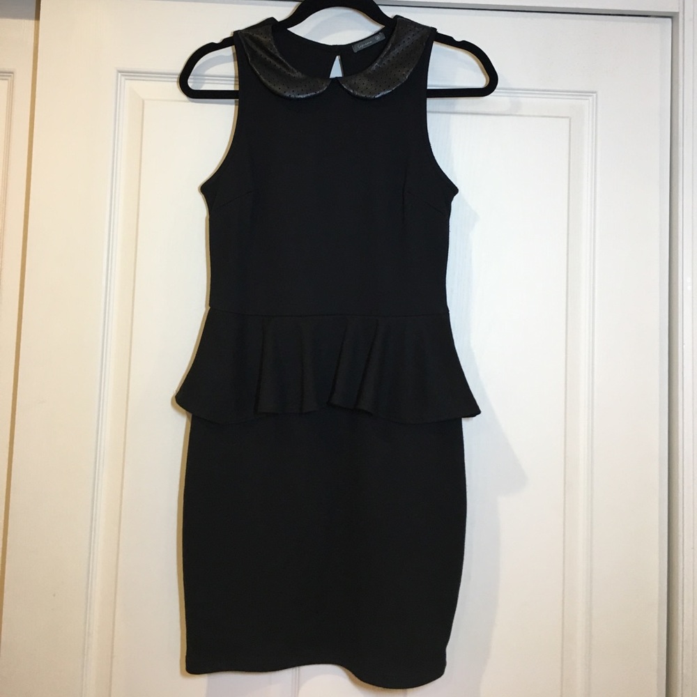Black sleeveless dress with peplum
