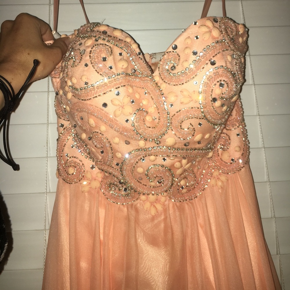 Pink, strapless, Nina Canacci prom dress