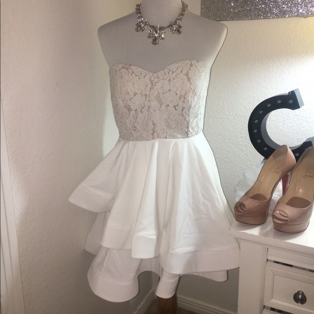 Strapless white dress with floating hem