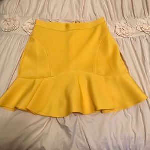 Yellow peplum mini skirt