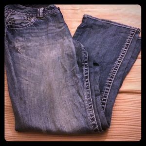 Acid wash boot cut with light rips in jeans