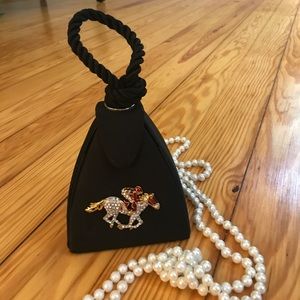 Black silk evening bag with race horse in diamonds