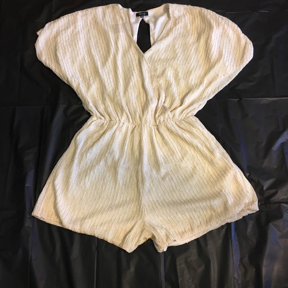 Ivory Romper by Verty.  Size M