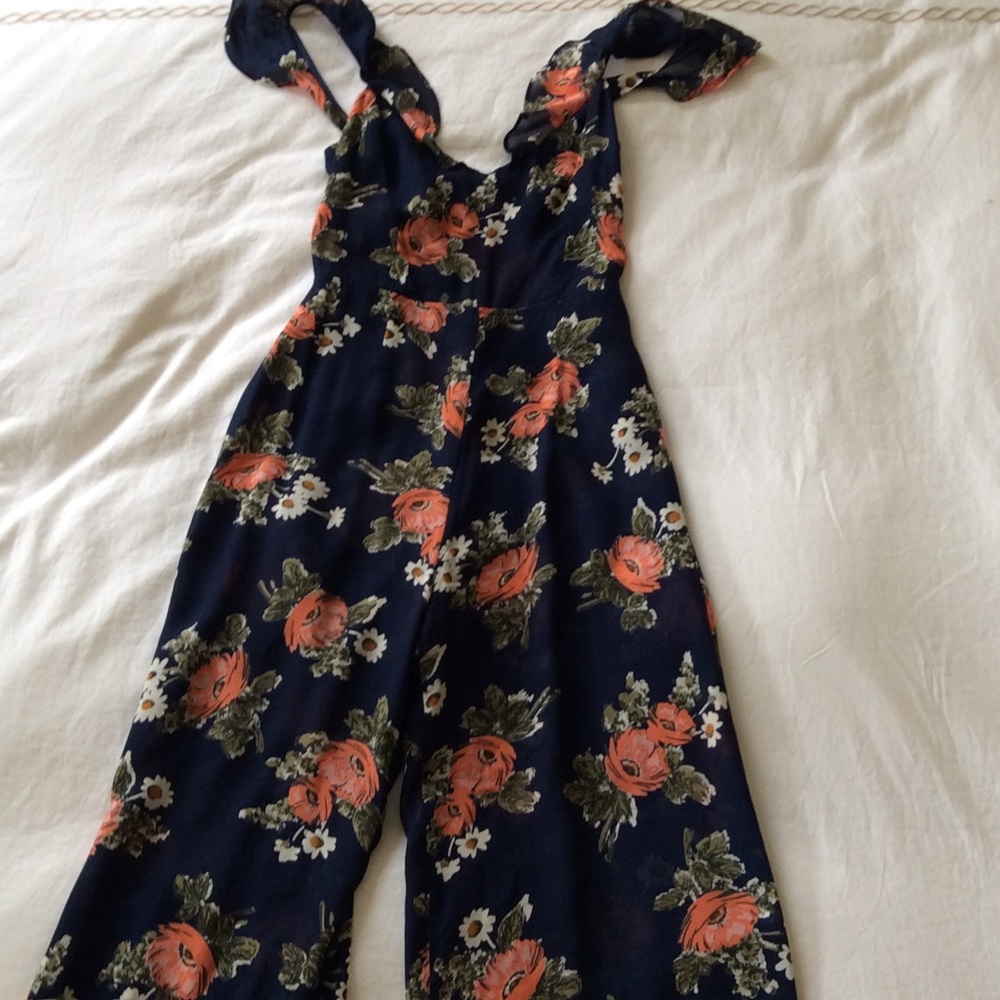 Reformation jumpsuit with open back.