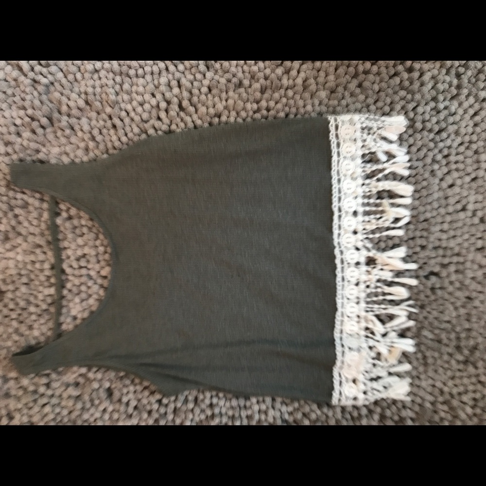 Cute tan top with fringe on the ends!