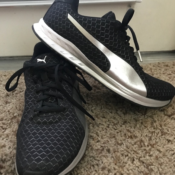 black and silver puma shoes