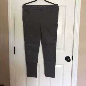 Gray skinny pants.