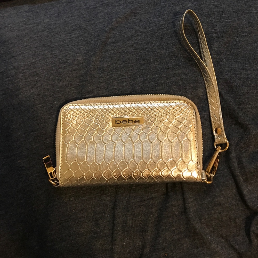 Bebe silver wristlet never used.