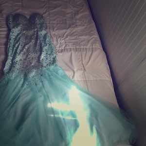 An aqua blue crystal covered prom dress
