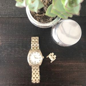 Nixon time teller watch in light gold