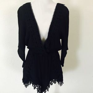 Black lace detail low cut romper. Size L