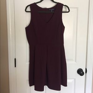 Plum color dress.