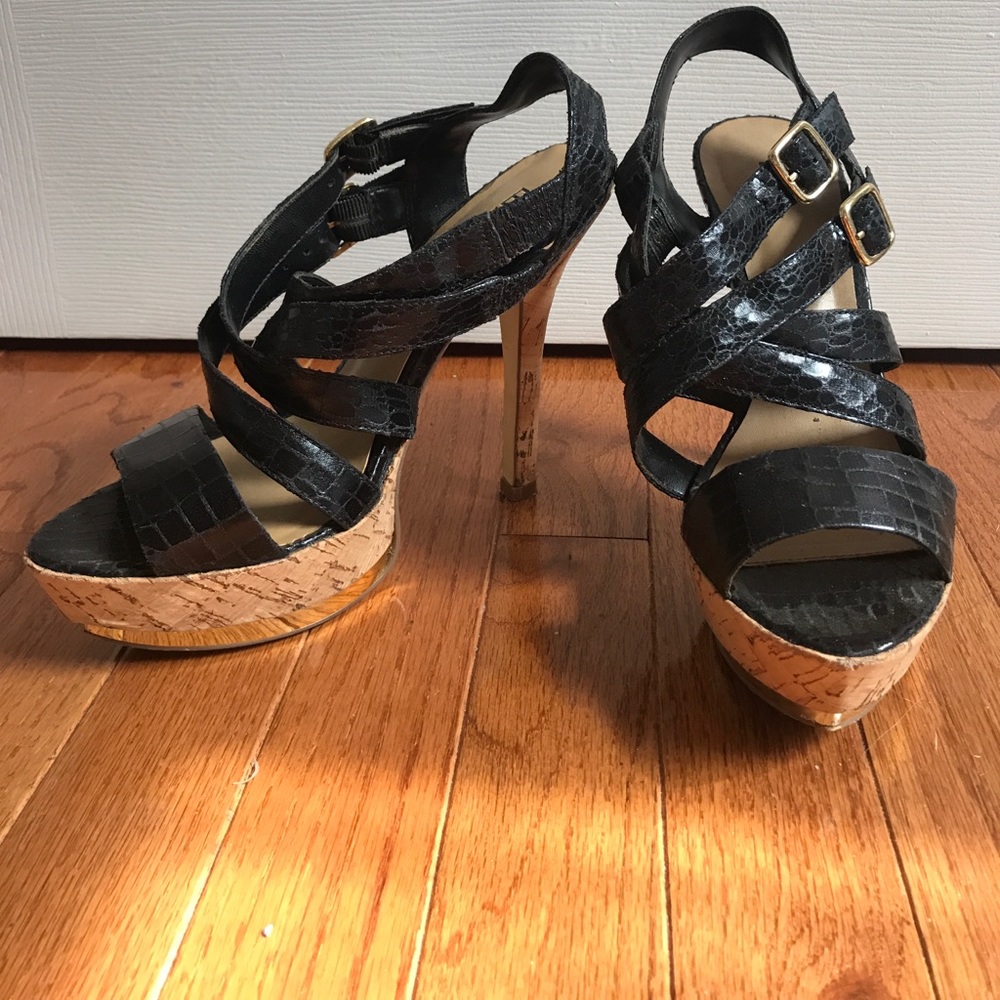 Black strappy heels with gold accents