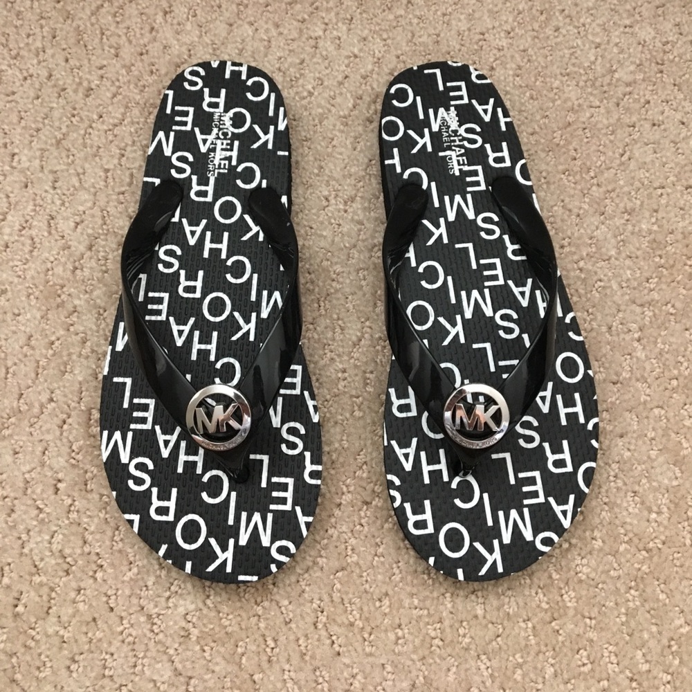 Michael Kors flip flops black size 6