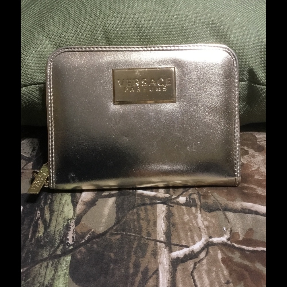 Versace wristlet. GOLD  brand new