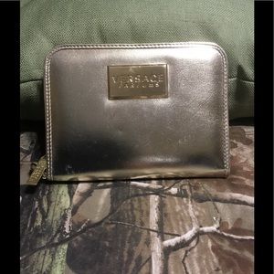 Versace wristlet. GOLD  brand new
