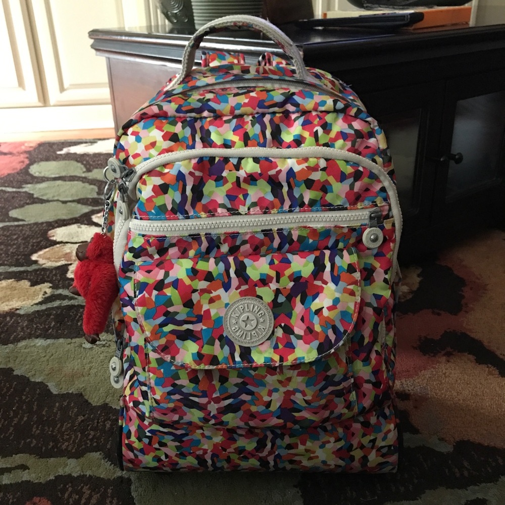 Authentic rolling preowned Kipling backpack