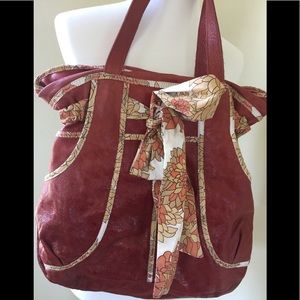 Anthropologie Retro-Hobo with floral accent bow